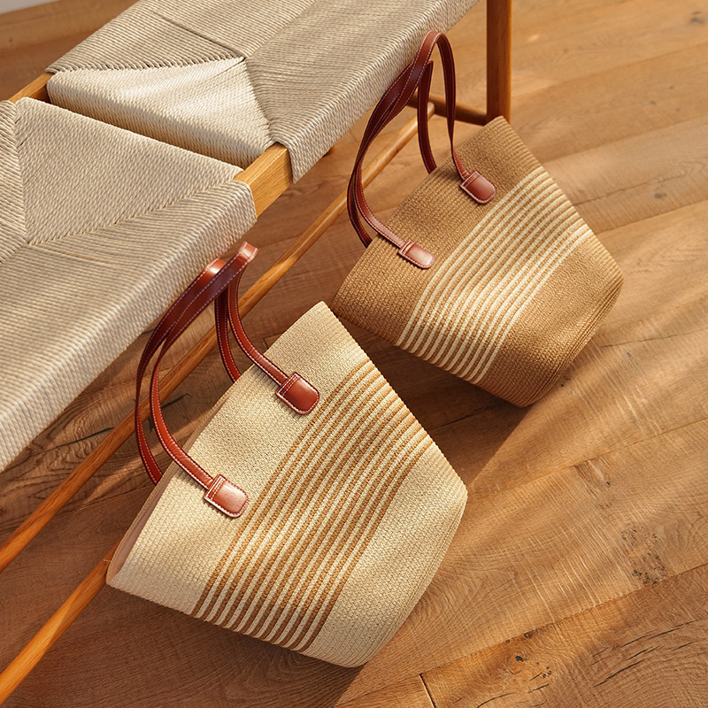 Two woven tote bags in natural colorways